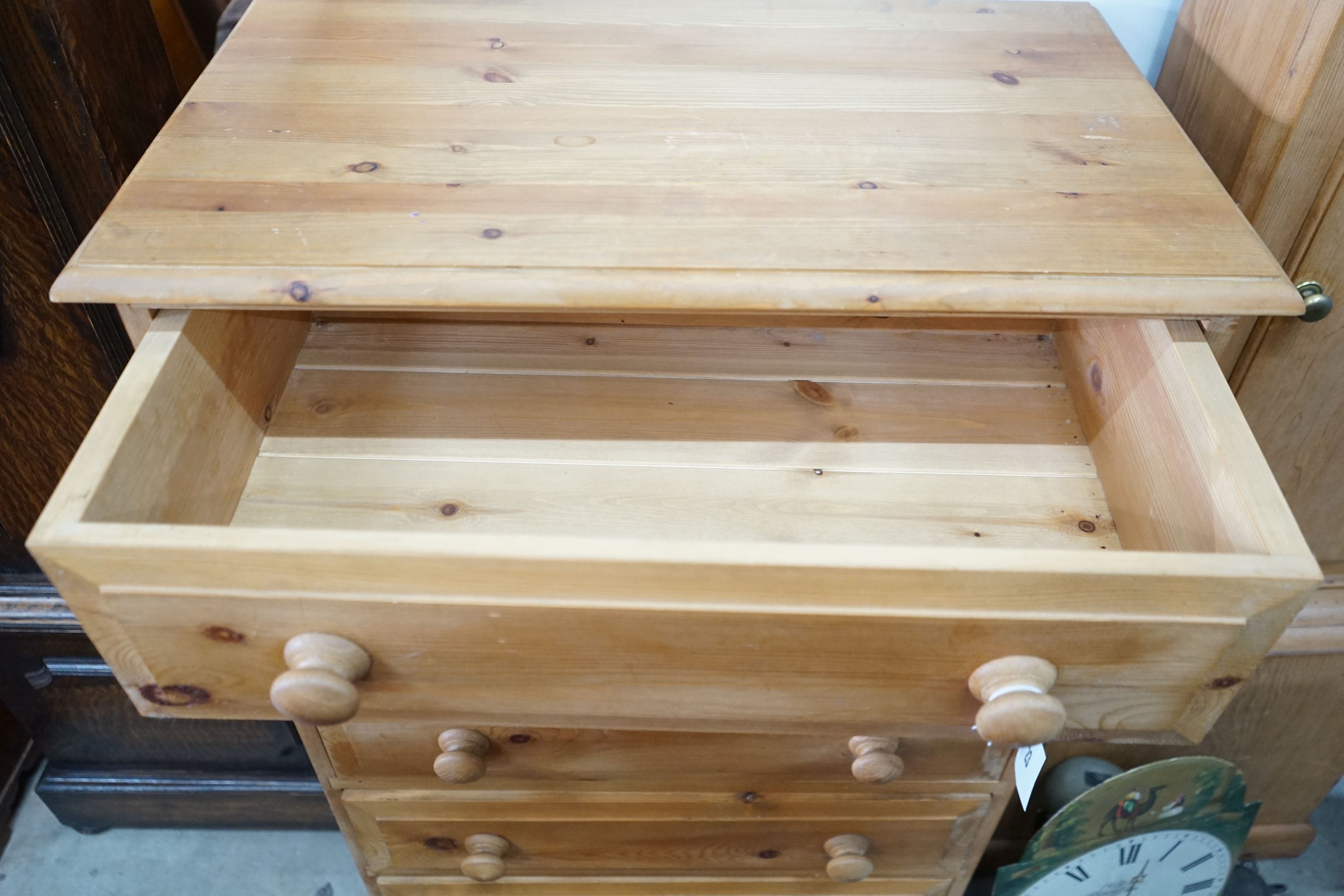 A small modern pine five door chest, width 69cm, depth 40cm, height 106cm